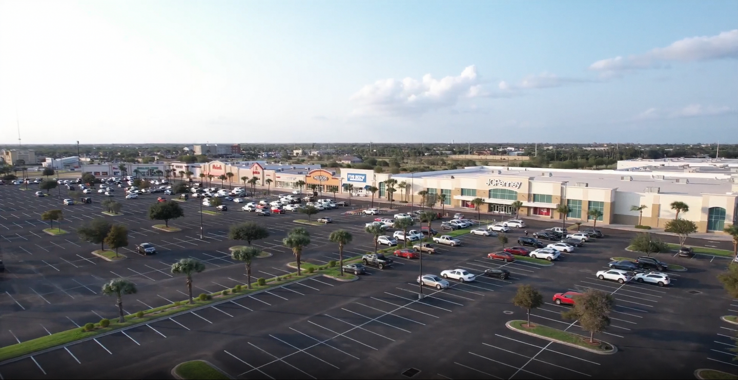 Aerial view of a shopping centre and parking in Edinburg