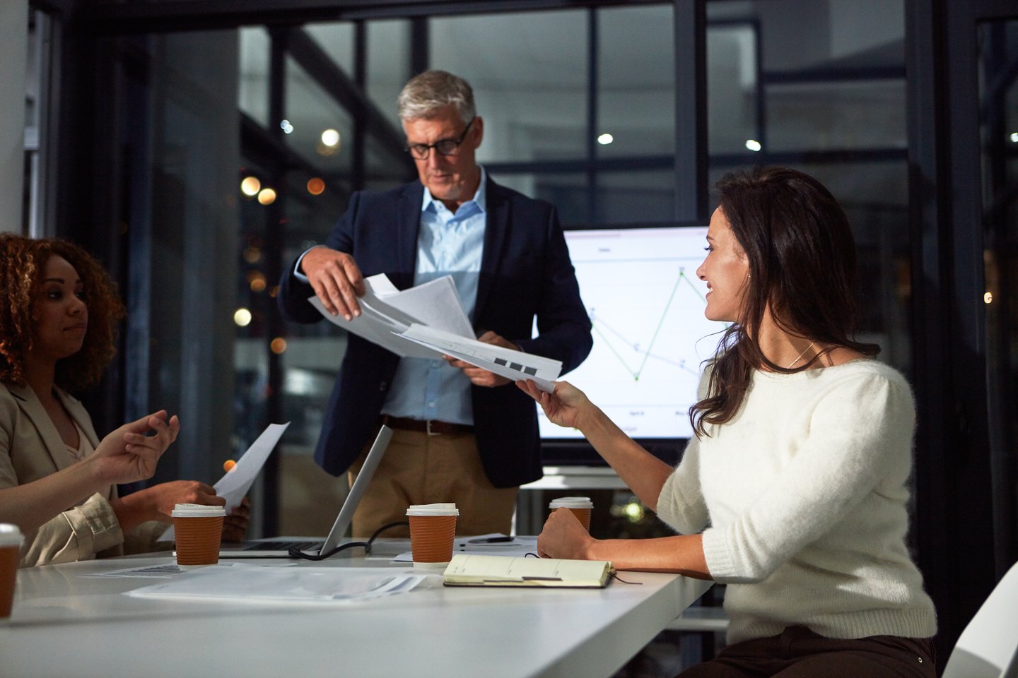 Two professionals reviewing project plans together