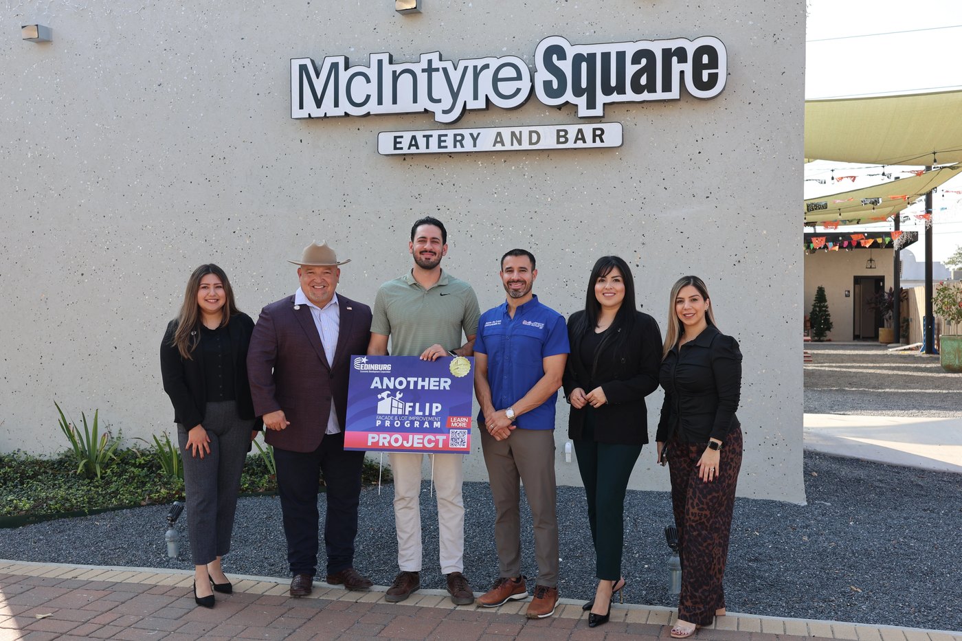 Edinburg EDC staff with a local business owner
