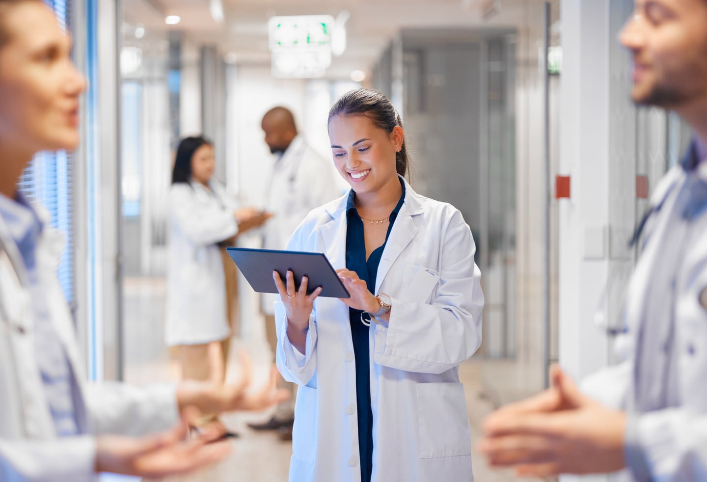 Doctors conferring in a hospital corridor in Edinburg