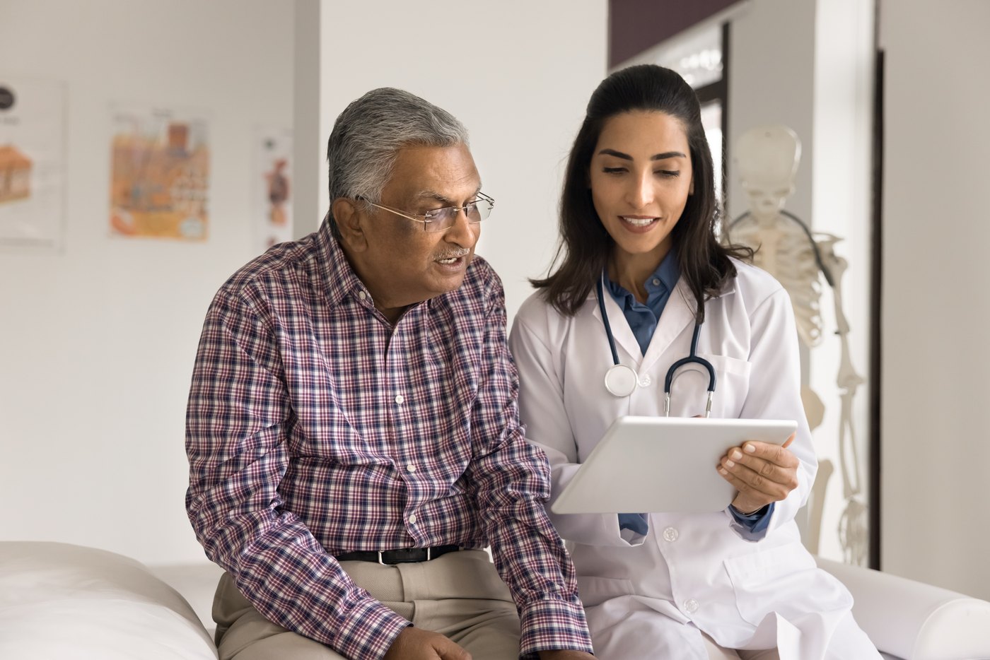 A doctor consulting with a patient in Edinburg